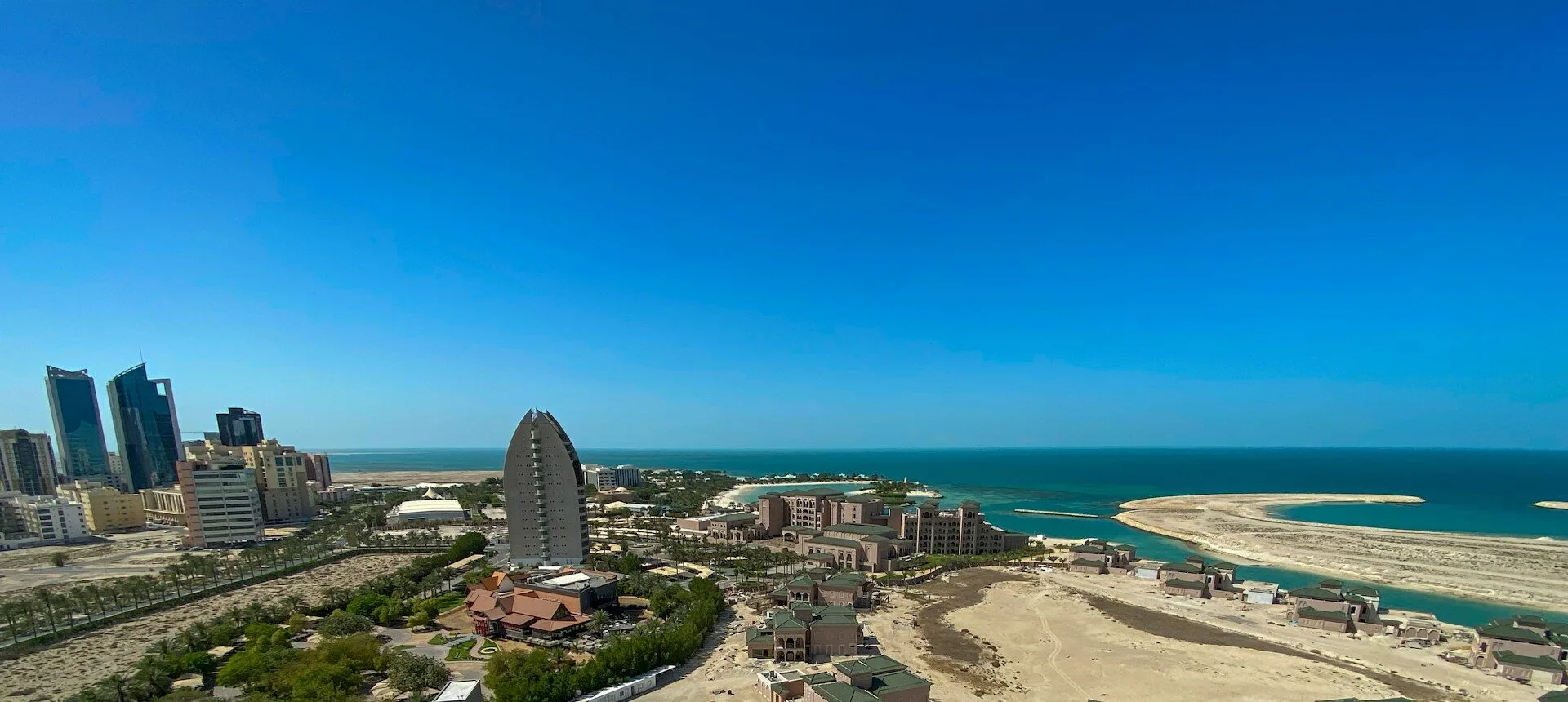 View of Manama, Bahrain city out towards the water and horizon.